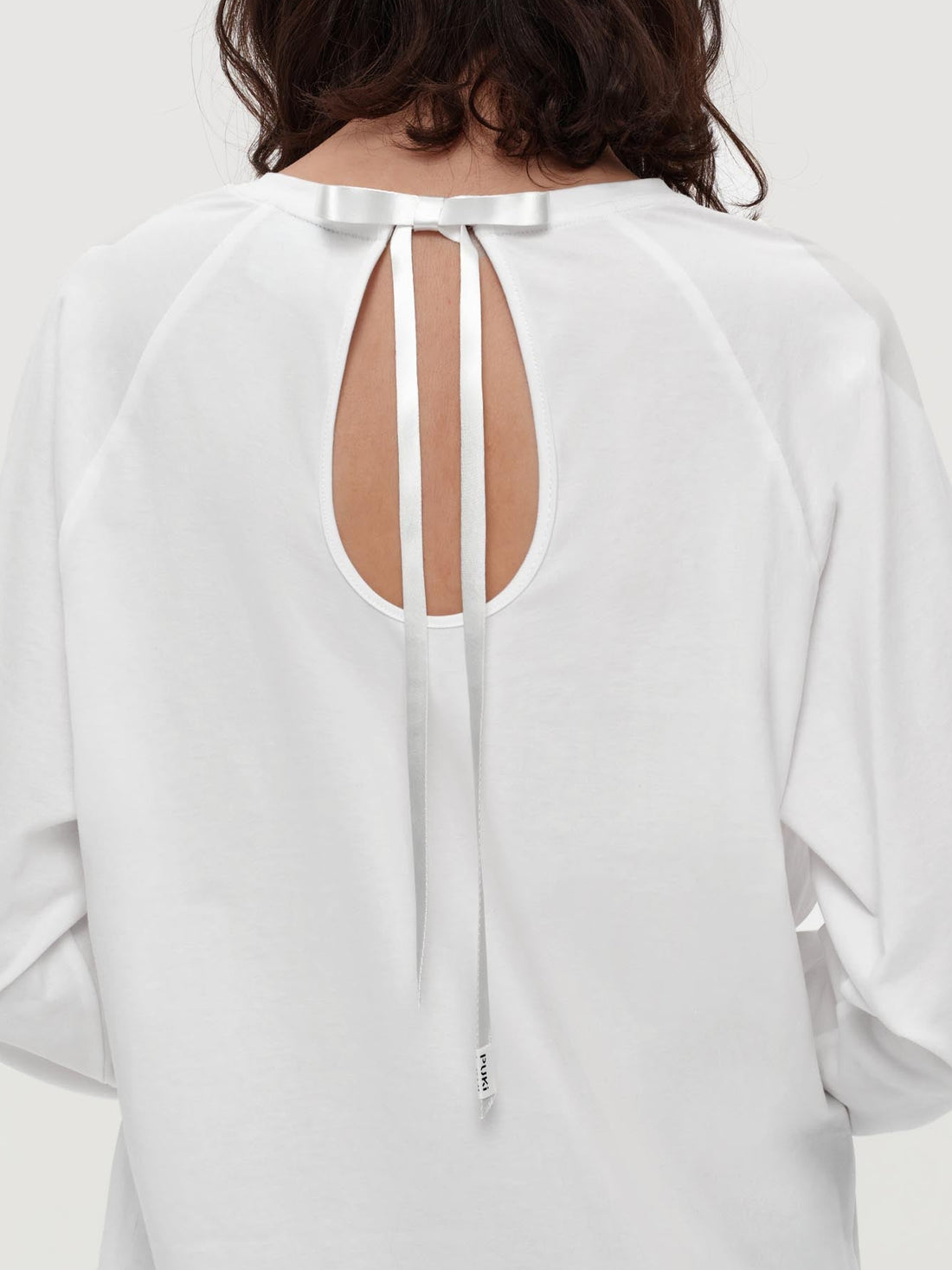 The Bow Back Layer Top